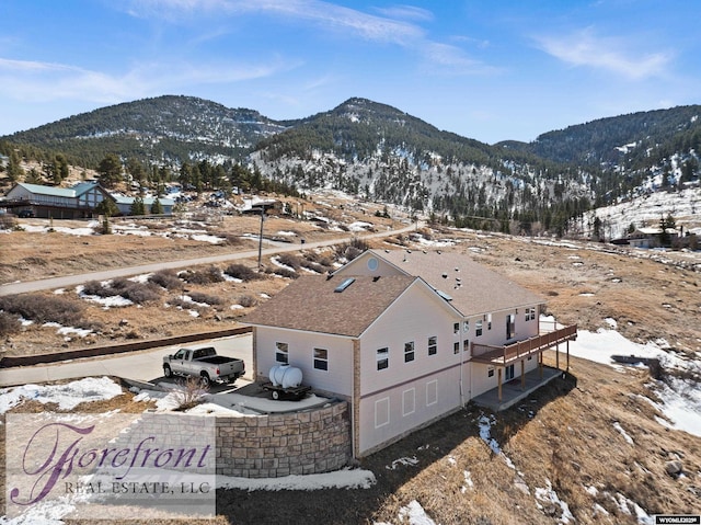 birds eye view of property with a mountain view