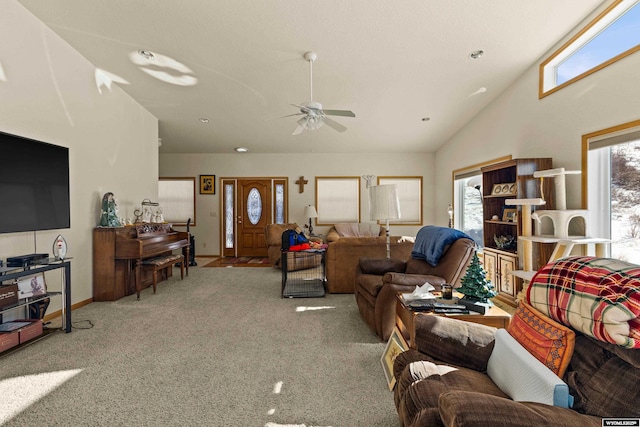 living room featuring carpet flooring, a ceiling fan, and high vaulted ceiling