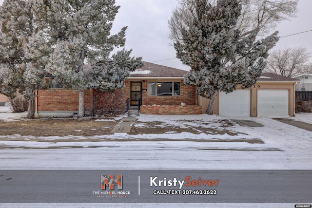 view of front of property featuring a garage