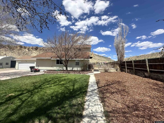 205 Oakley St, Kemmerer, WY 83101 - view of front facade featuring a garage and concrete driveway