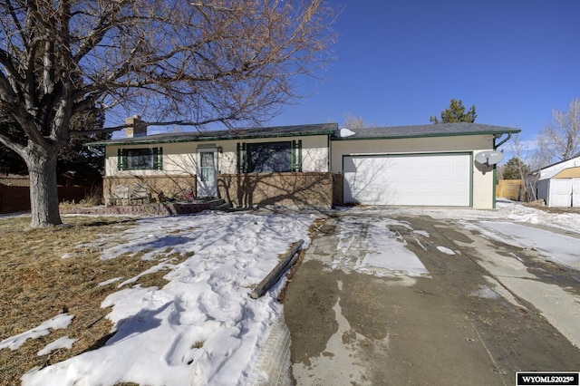 ranch-style home featuring a garage