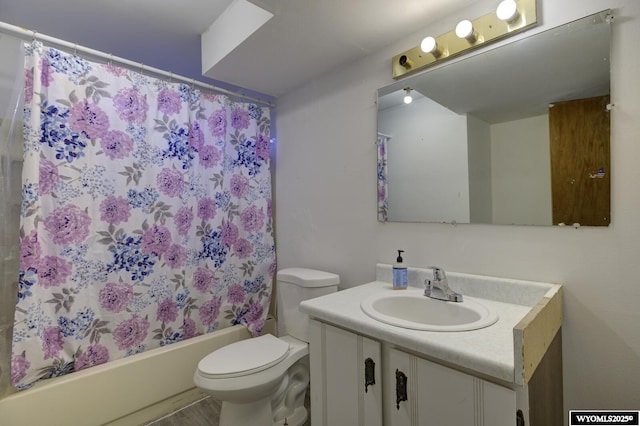 full bathroom with shower / bathtub combination with curtain, vanity, and toilet