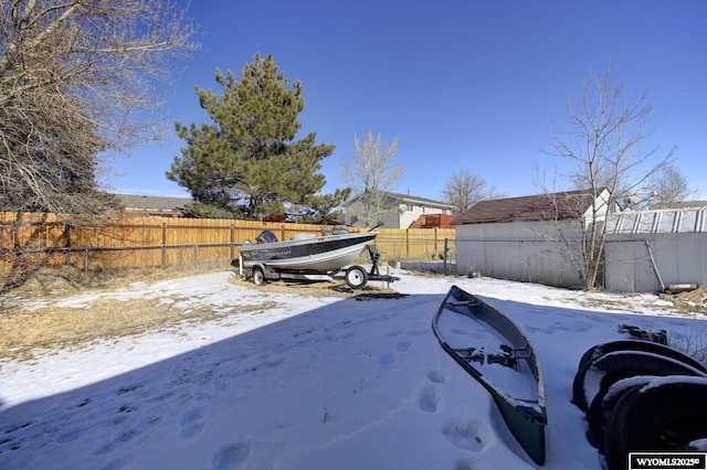 view of yard covered in snow