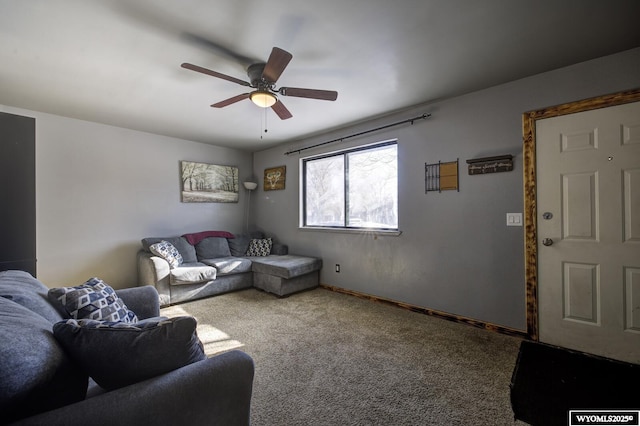 carpeted living room with ceiling fan