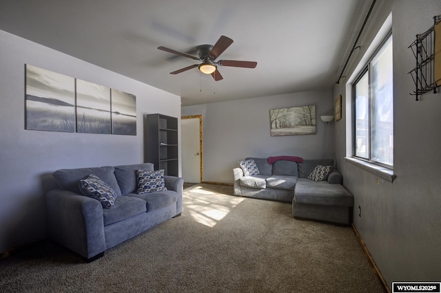 living room featuring carpet floors and ceiling fan