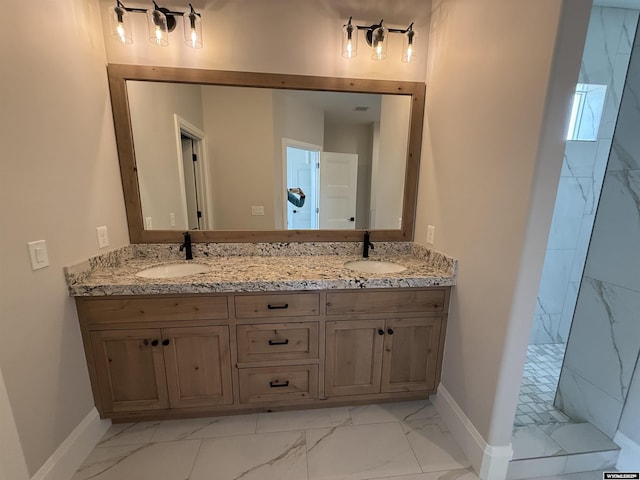 2707 Bailey Blvd, Rock Springs, WY 82901 - full bathroom with marble look tile flooring, double vanity, baseboards, and a walk in shower