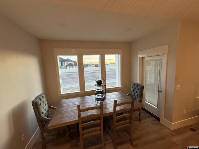 dining area with hardwood / wood-style flooring