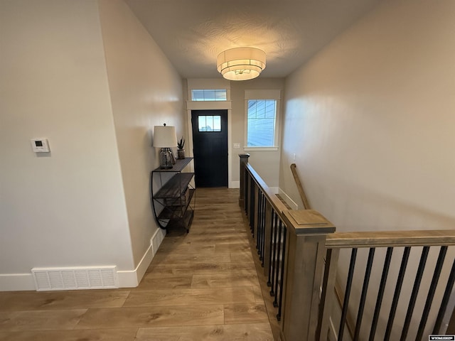 doorway to outside featuring light wood-type flooring