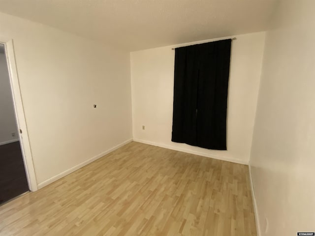 unfurnished room featuring light wood-type flooring