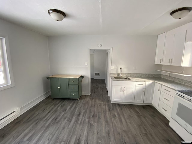 kitchen with dark hardwood / wood-style flooring, sink, electric range, and white cabinets