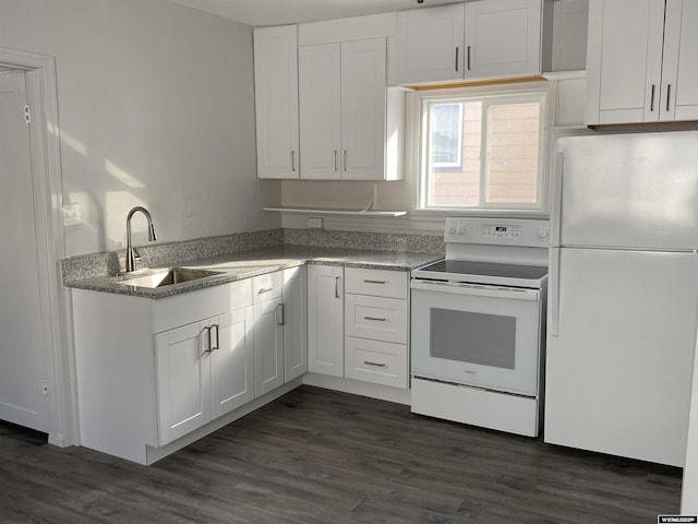 kitchen featuring dark hardwood / wood-style flooring, sink, white appliances, and white cabinets