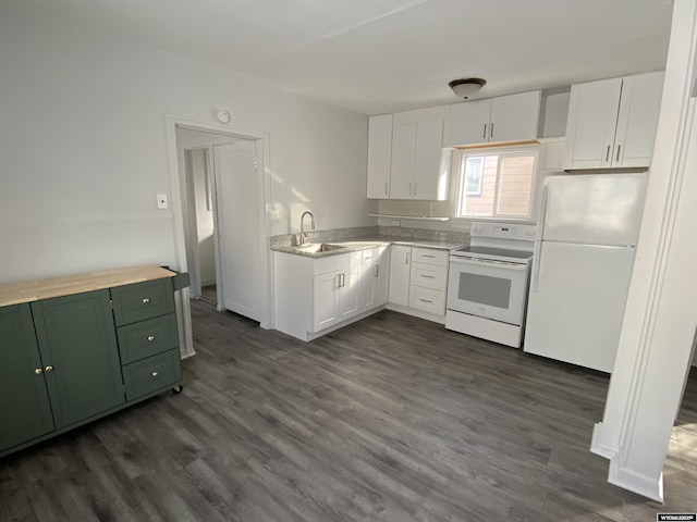 kitchen with dark wood-type flooring, white appliances, sink, and white cabinets