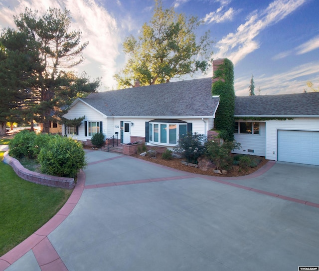 ranch-style house featuring a garage