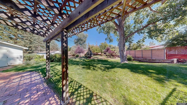 view of yard with a pergola and a patio