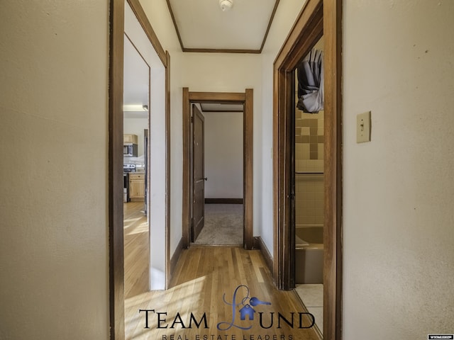 hallway with light wood-type flooring