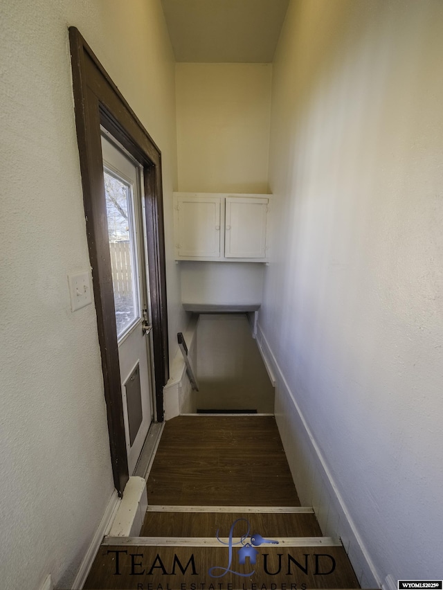 stairway featuring hardwood / wood-style floors