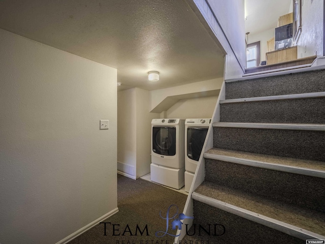 washroom featuring washer and dryer and carpet