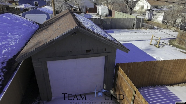 view of snow covered garage