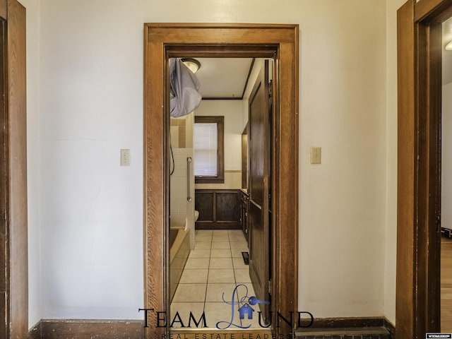 hallway featuring light tile patterned flooring