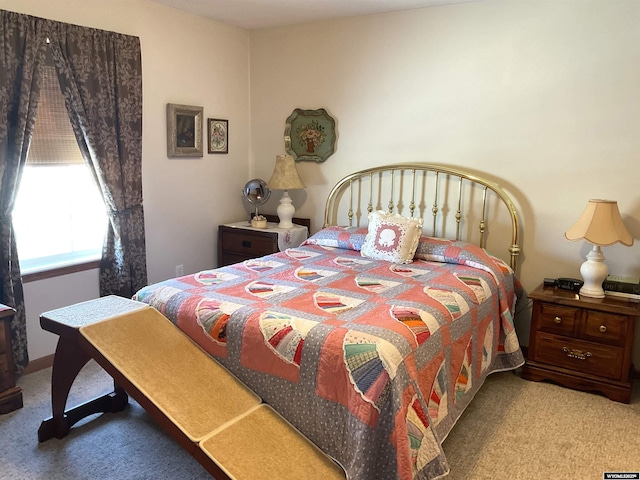 bedroom with light colored carpet