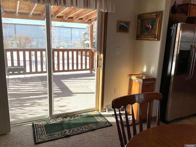 doorway with carpet floors