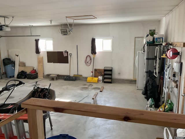 garage with a garage door opener and white fridge