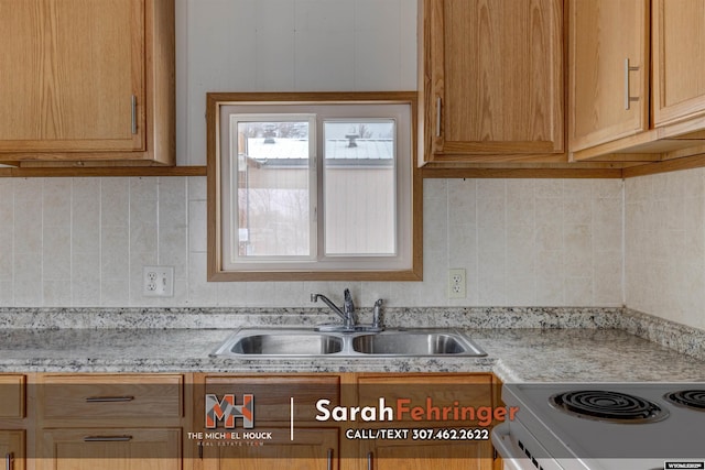 kitchen featuring tasteful backsplash and sink