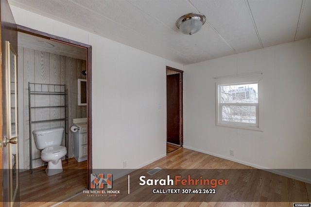 unfurnished bedroom featuring hardwood / wood-style floors