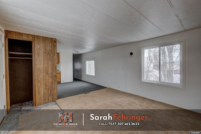 interior space with dark colored carpet