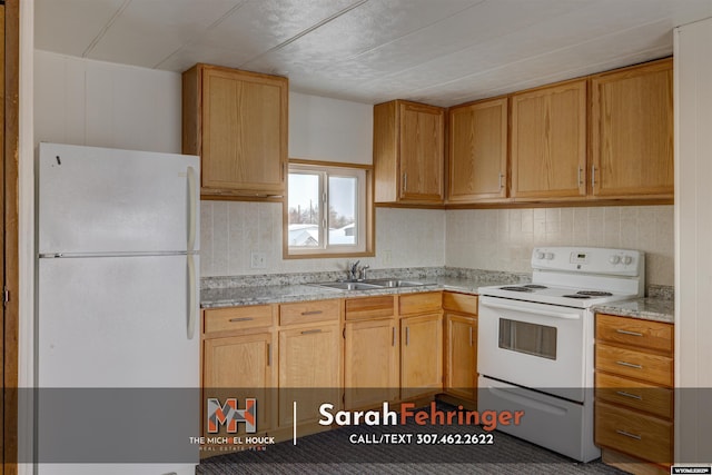 kitchen featuring light stone counters, sink, white appliances, and light brown cabinets