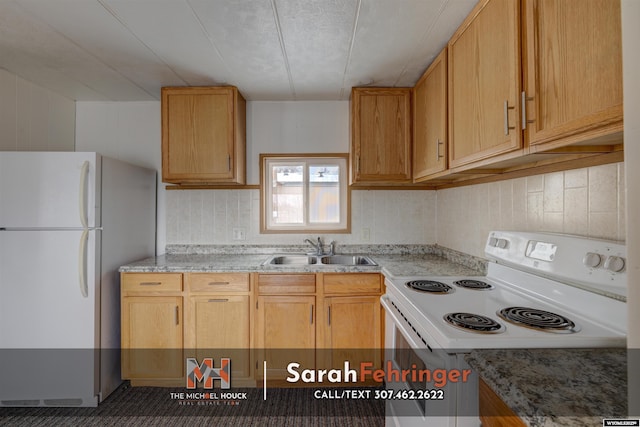 kitchen featuring sink, white appliances, and light brown cabinets