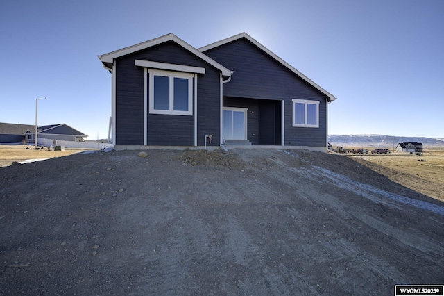 view of front of property with a mountain view