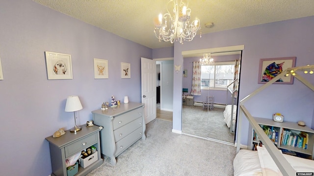 carpeted bedroom featuring a textured ceiling, a baseboard radiator, and a chandelier