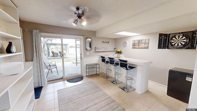 interior space with ceiling fan