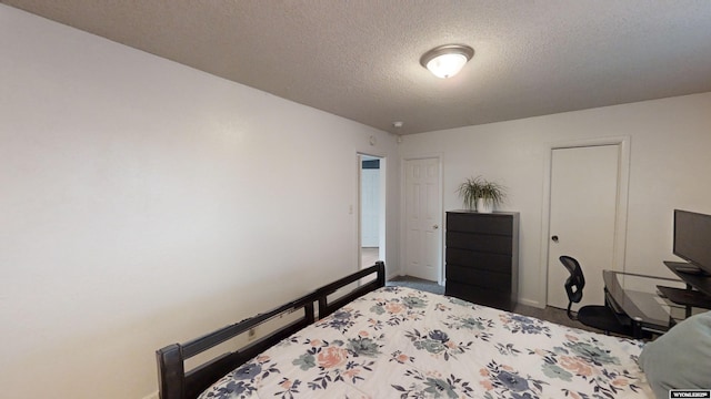 bedroom featuring a textured ceiling