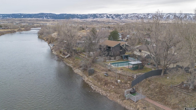 drone / aerial view featuring a water and mountain view