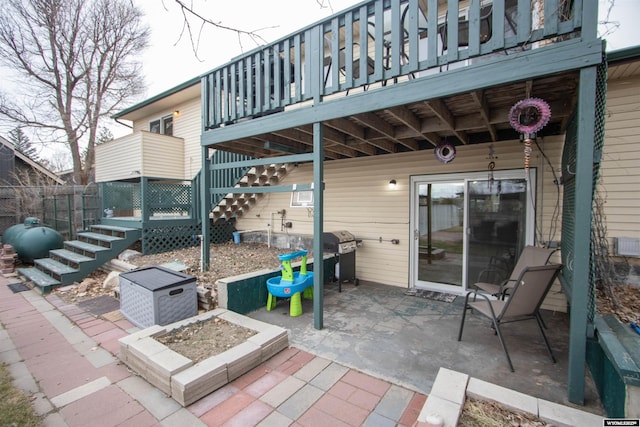 view of patio / terrace featuring grilling area and a fire pit