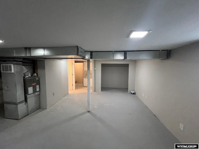 basement featuring heating unit