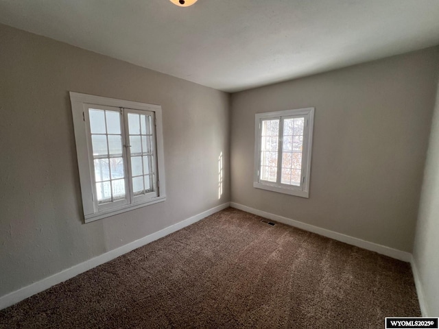 unfurnished room with carpet floors