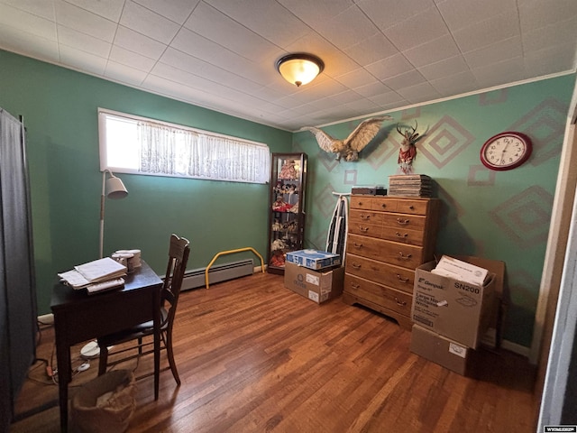 home office with wood-type flooring and a baseboard radiator