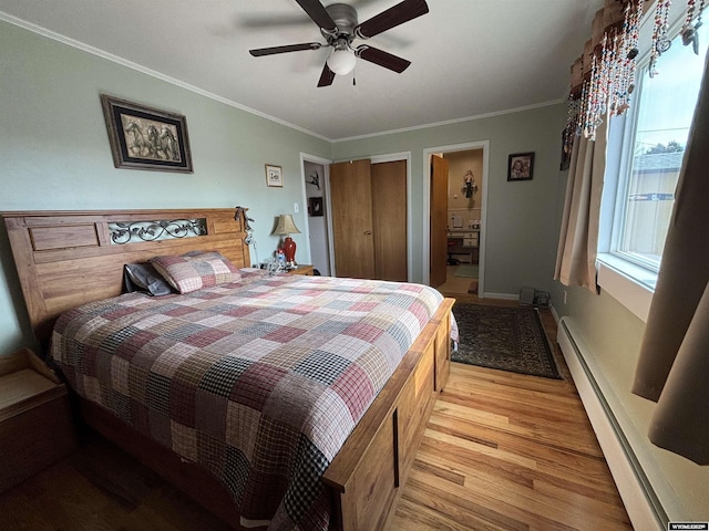 bedroom with connected bathroom, crown molding, light hardwood / wood-style flooring, ceiling fan, and a baseboard heating unit