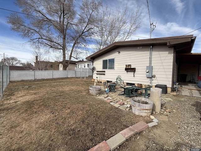 back of property featuring a fire pit