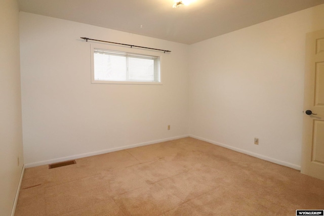 empty room with light colored carpet