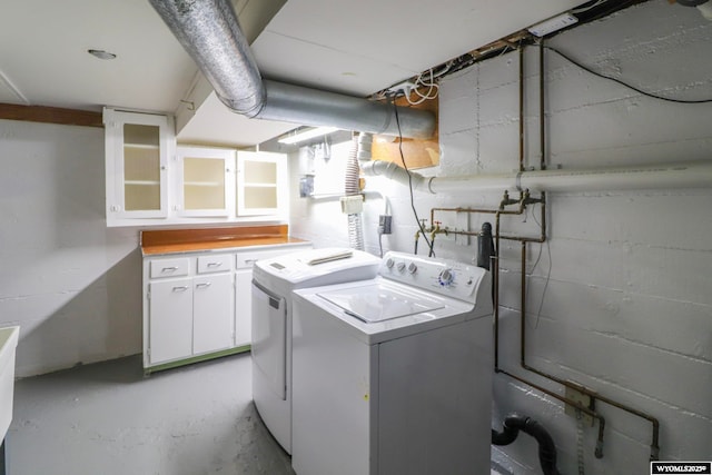 clothes washing area featuring washer and dryer