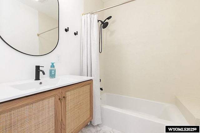 bathroom featuring vanity and shower / tub combo with curtain