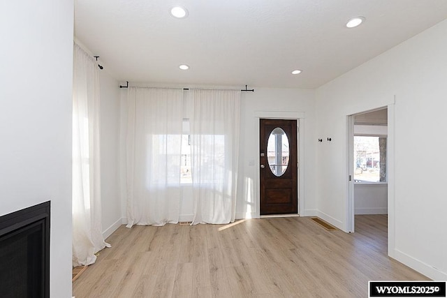 entryway with light hardwood / wood-style flooring