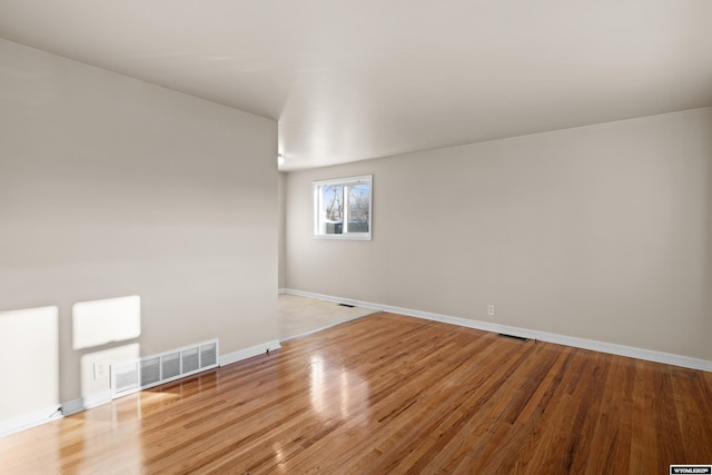 spare room featuring light hardwood / wood-style floors