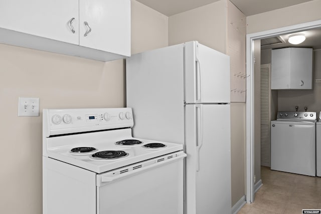 kitchen featuring white cabinetry, washer / dryer, and white appliances