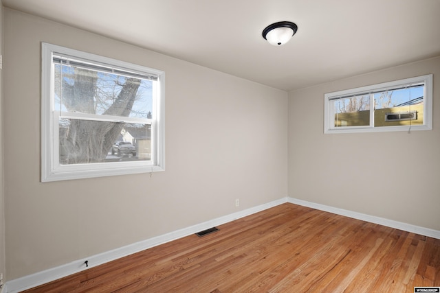 unfurnished room featuring light hardwood / wood-style flooring