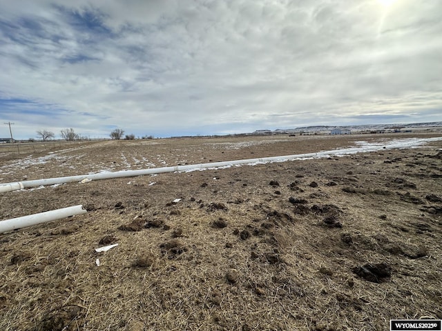 view of yard with a rural view